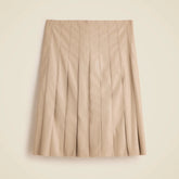 Pleated knee-length skirt in faux leather