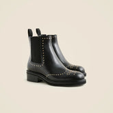 Chelsea wing tip boots in studded leather
