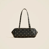 Delphine shoulder bag in studded leather