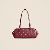 Delphine shoulder bag in studded leather