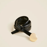 Skinny disc belt in leather