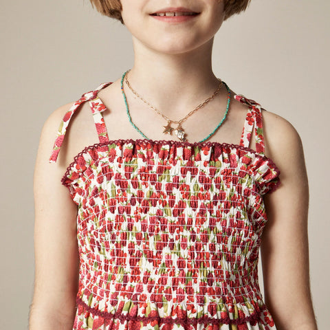 Girls' smocked dress in raspberry burst print