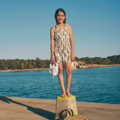 Girls' smocked romper in blooming lilac block print