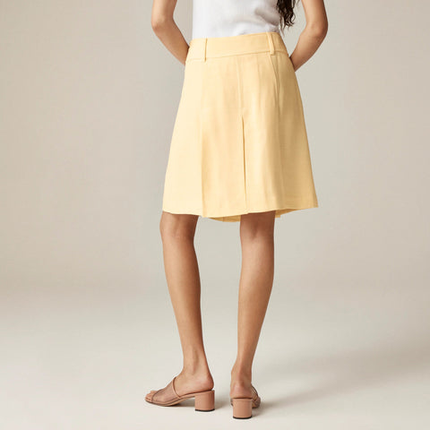 Pleated knee-length skirt in luster canvas