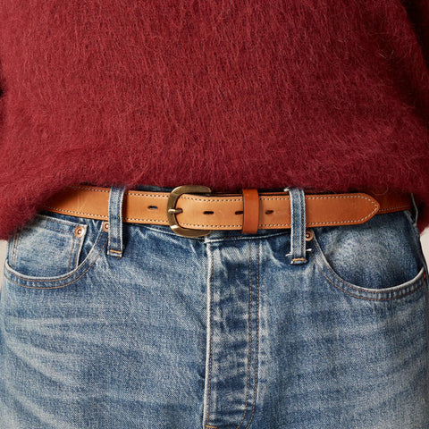 Leather belt with round brass buckle