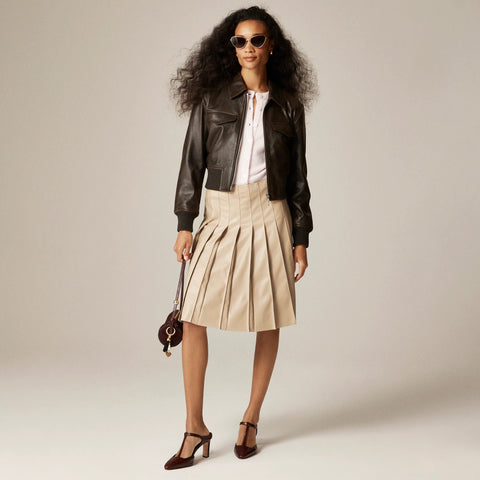 Pleated knee-length skirt in faux leather