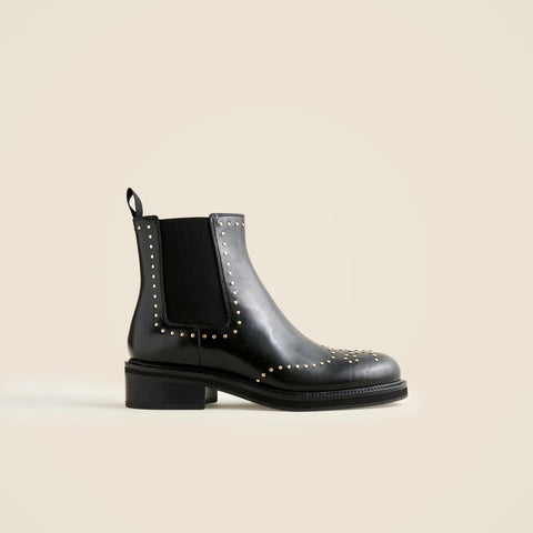 Chelsea wing tip boots in studded leather