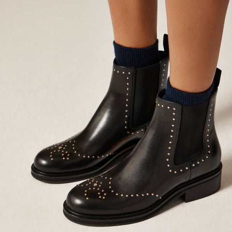 Chelsea wing tip boots in studded leather
