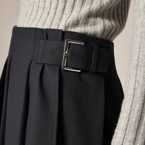 Pleated mini skirt with buckle detail