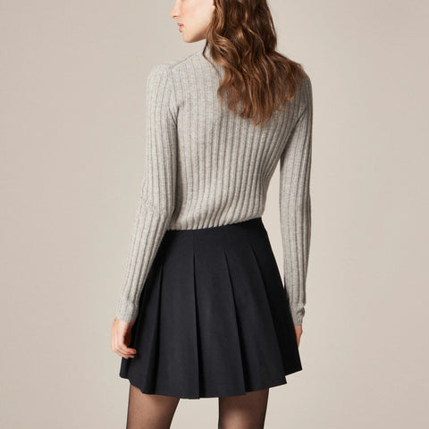 Pleated mini skirt with buckle detail