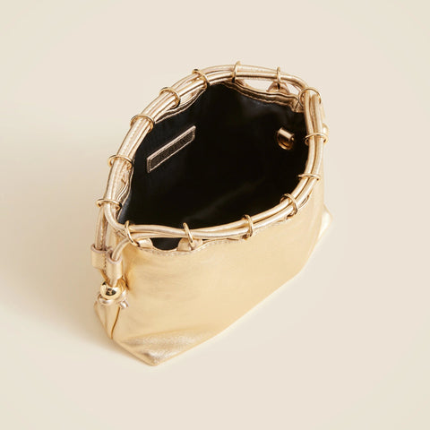 Drawstring pouch bag in metallic leather