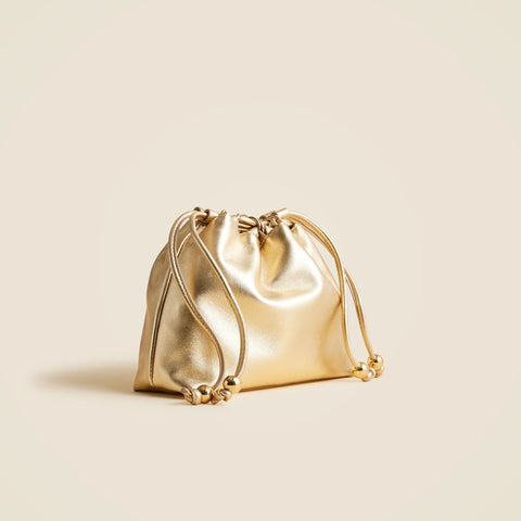 Drawstring pouch bag in metallic leather