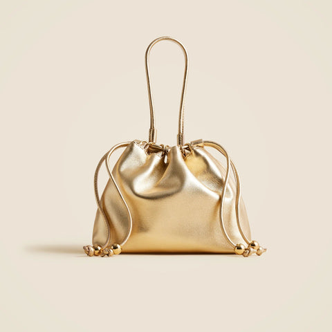 Drawstring pouch bag in metallic leather